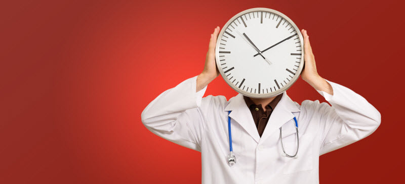 Providers saving time video visits - Image of a doctor holding a clock over his face